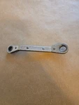 Mac Tools 3/8"-7/16" 12PT Sae Offset Reversible Ratcheting Box Wrench ROW12142. Fixed Price $16.00.
